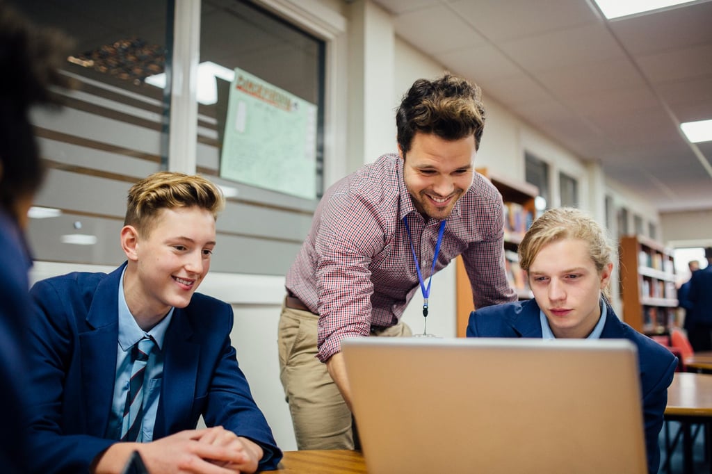 HS_uniform_with teacher_iStock-641755548