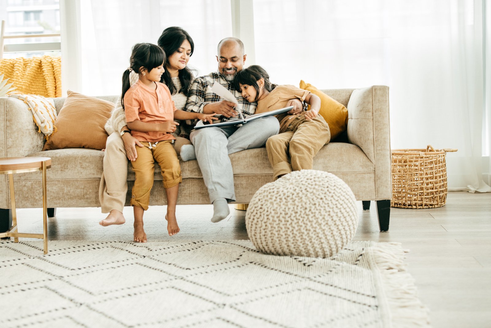family on couch 2 iStock-1367929084