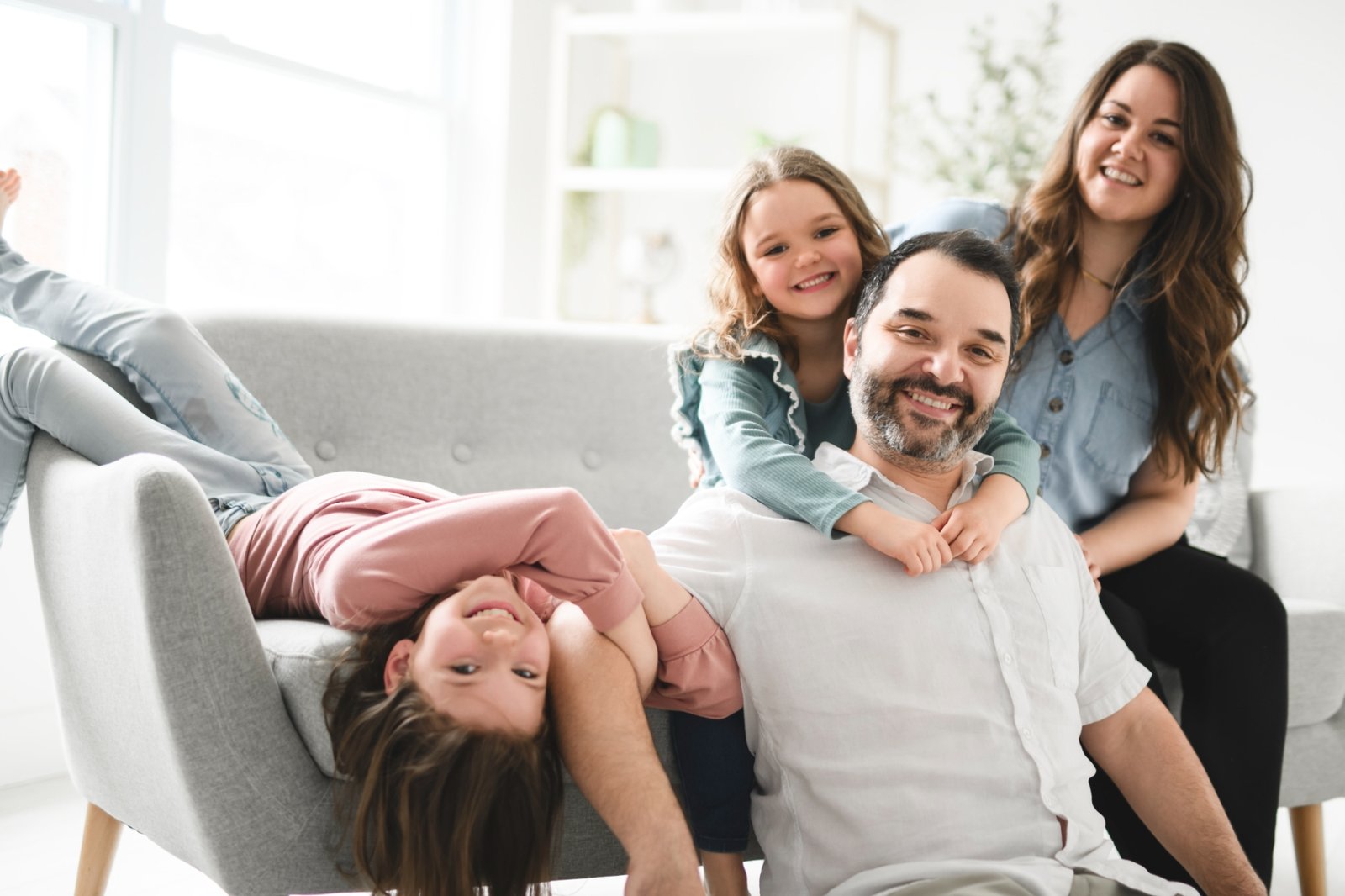 family on couch 3 iStock-2212752069