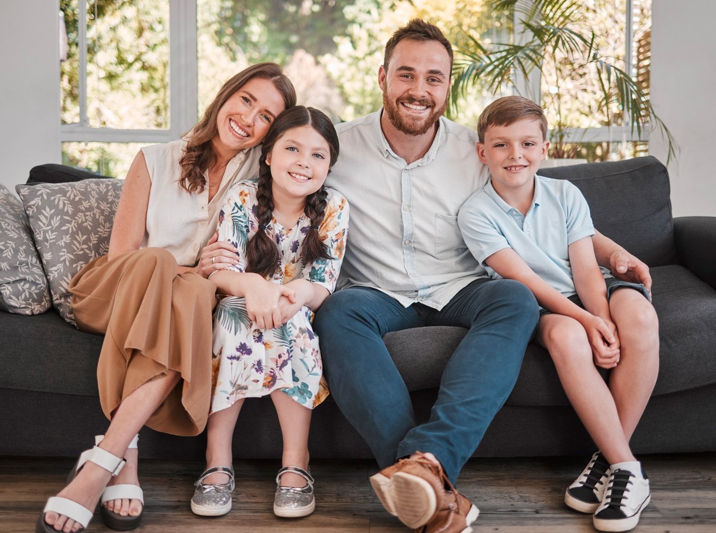 family on couch iStock-1372872813