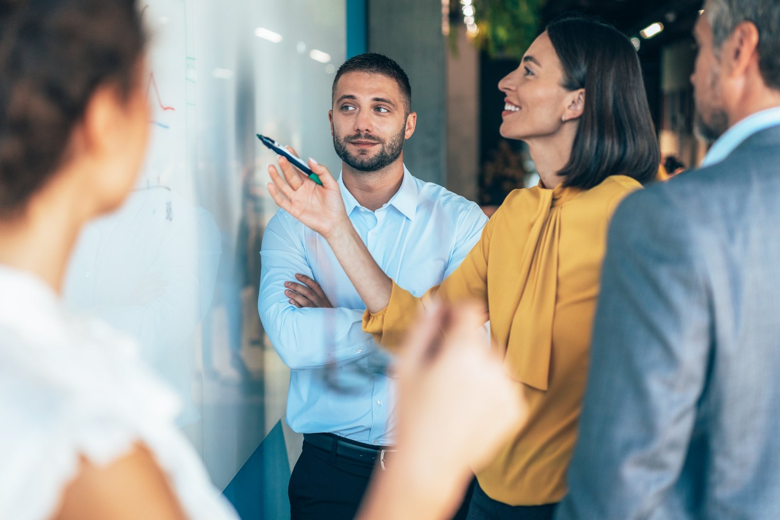 group at whiteboard iStock-2188554976