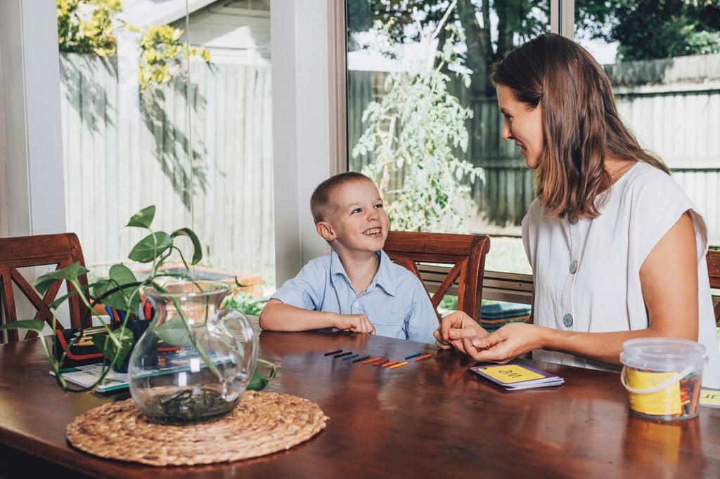 mother and son at table iStock-1221563504